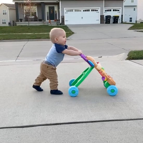 Baby walking with stroller